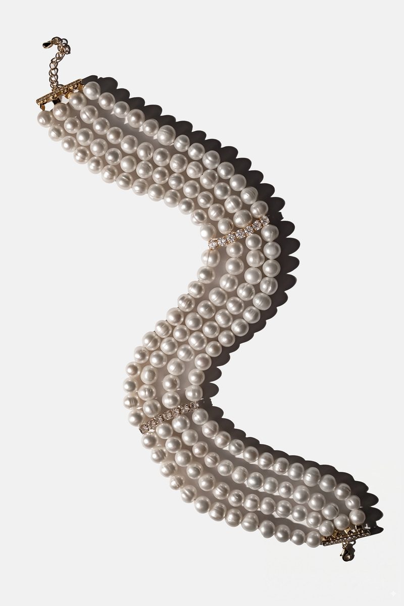 Four-strand white pearl choker with crystal details